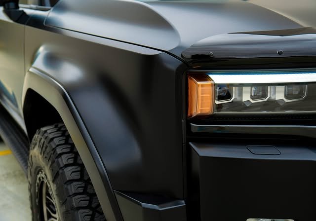 Close-up of the matte film over the Prado front guard and headlight