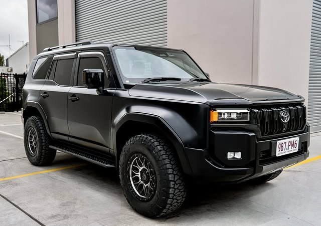 Toyota LandCruiser Prado in satin black matte PPF outside the studio